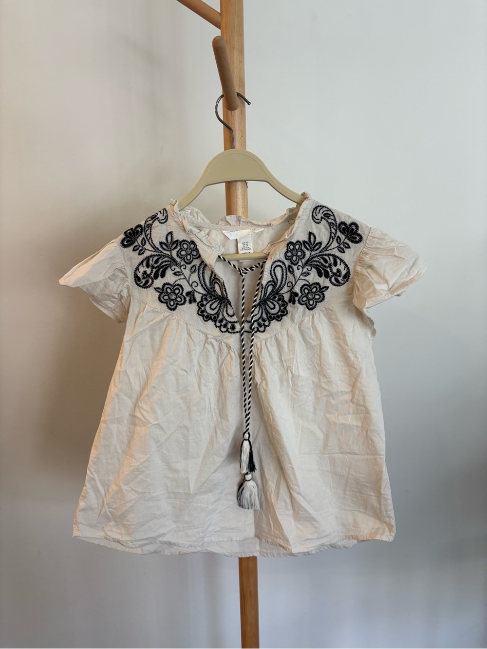 H&M Cream Top with Black Floral Embroidery and Tassel